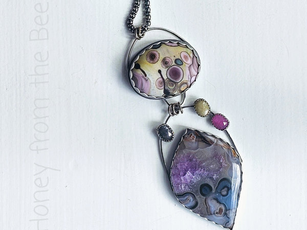Colorful Statement necklace features agate, art glass and sapphires in blue, purple, pink and yellow.